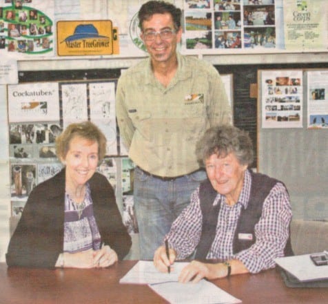 Photo of landcare SJ officers and PHCC rep, signing funding agreement, courtesy of Examiner newspaper.