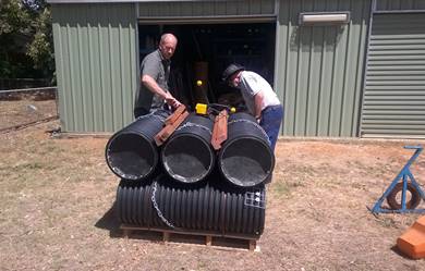 two men preparing artificial nest boxes for shipment to Victoria