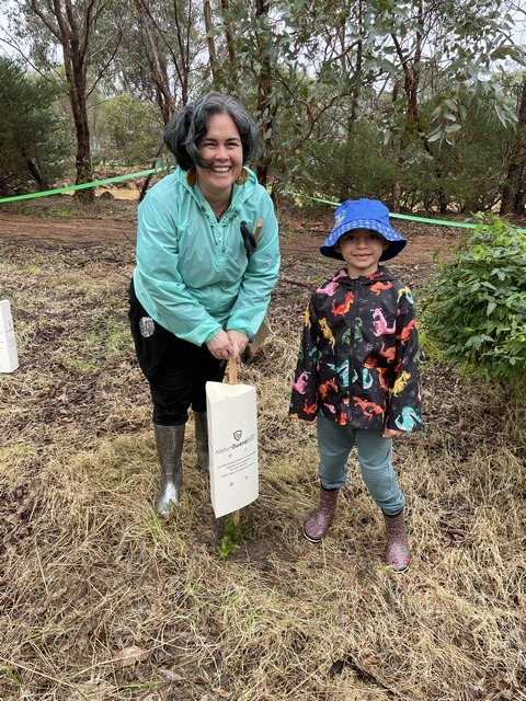 A mother and child planting