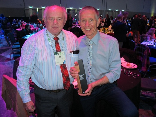 two men with a Landcare award